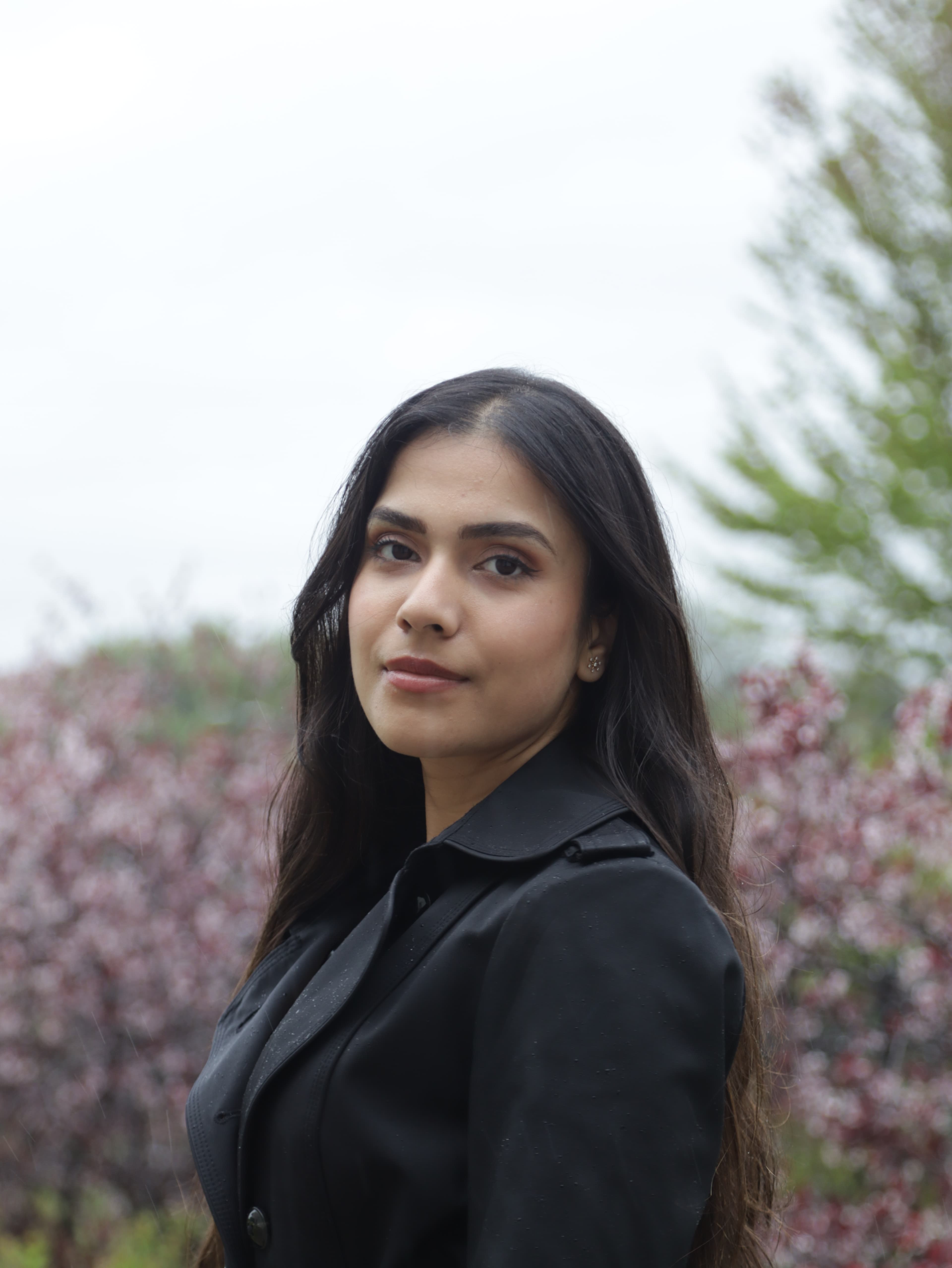 Solo portrait of a woman in a black jacket